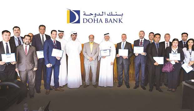 Doha Bank CEO Dr R Seetharaman joins the latest recipients of the monthly u2018Employee Recognition Awardsu2019 programme.