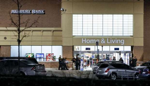 Police investigate the scene of a shooting at a Wal Mart store in Colorado