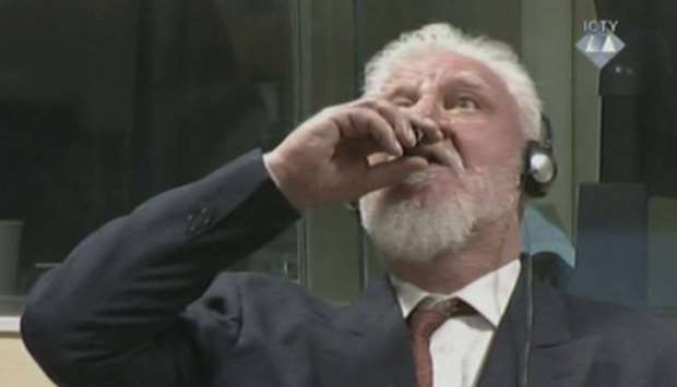 Slobodan Praljak, is seen drinking poison during a hearing at the UN war crimes tribunal in the Hague.