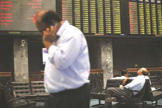 Traders monitor stocks in a trading hall at the Karachi Stock Exchange. The Pakistan Stock Exchange is all set to attract more Chinese investment next year as foreign investors seek approval from their governmental institutions to acquire shares in Pakistanu2019s top 30-listed companies, according to officials.