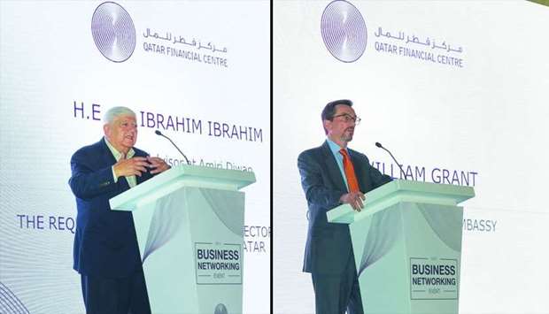 Dr. Ibrahim Ibrahim, Emiri Diwan economic adviser (L) and William Grant, US Ambassador (L) speak