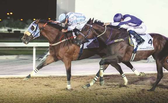 Jockey Alberto Sanna (left) rides Karraar to victory ahead of Third Dimension, ridden by Harry Bentley, in the Al Khor Cup at the QREC yesterday.