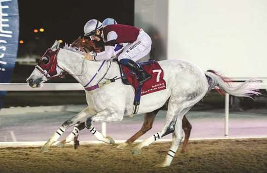 Jockey Harry Bentley (foreground) rides Injaaz Studu2019s My Sharona to victory in the Umm Al Houl at the Qatar Racing and Equestrian Club (QREC) yesterday. PICTURES: Juhaim