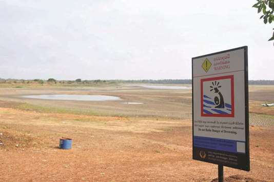 A view of a nearly-dry water storage pond near Siyambalankattuwa in Sri Lankau2019s Puttalam District, North Western Province.