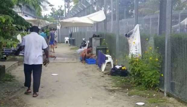 Asylum seekers are seen at a detention centre on Manus Island, Papua New Guinea, in this still image taken from social media video on Friday.