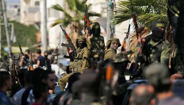 Palestinian fighters from the Islamic Jihad movement attend the funeral of comrades killed in an Israeli operation to blow up a tunnel stretching from the Gaza Strip into Israel during their funeral at the Bureij refugee camp, in central Gaza, earlier this week.