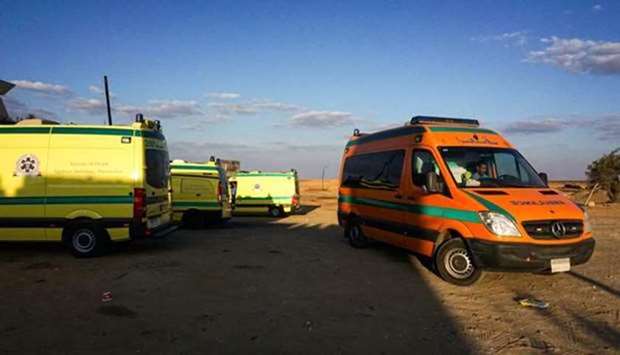Ambulances parked in the desert towards the Bahariya oasis in Egypt's Western desert near the site of an attack that left dozens of police officers killed in an ambush by Islamist fighters on October 21, 2017.