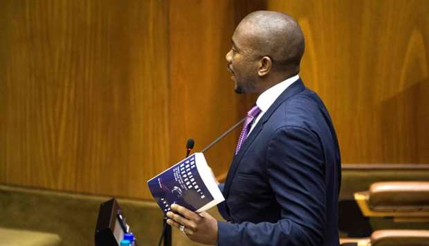 Leader of the official opposition Mmusi Maimane asks a question to South African President referring to a book titled 'The President's Keepers' during the last presidential answer session this year, in the South African Parliament.