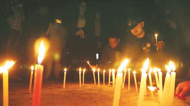 People participate in a candlelight vigil for victims of Trishuli River bus accident in Kathmandu. At least 31 passengers were killed in the accident as the bus en route to Kathmandu from Rajbiraj of eastern region of Nepal veered off the Prithvi Highway and plunged into the Trishuli in Dhading district on October 28.