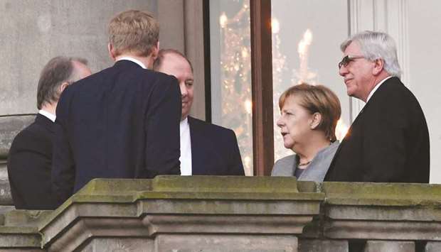 Merkel and other leaders of her Christian Democratic Union (CDU) party are seen yesterday during a break from the coalition talks.