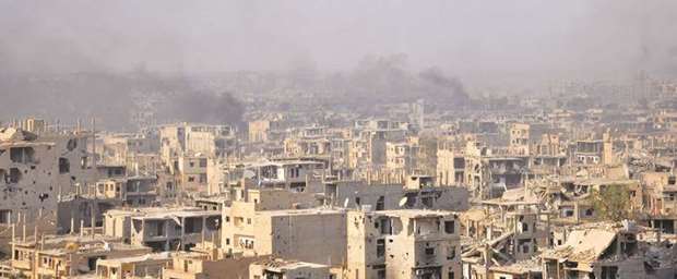 Smoke billows from the eastern Syrian city of Deir al-Zor during an operation by Syrian government forces against Islamic State (IS) group jihadists on Thursday. Syriau2019s army and allied forces have taken full control of the eastern city from the Islamic State group, Syrian state television said.