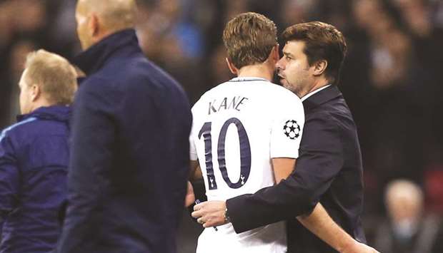 Tottenham Hotspur coach Mauricio Pochettino (right) speaks to Harry Kane after he is substituted during the UEFA Champions League match against Real Madrid at Wembley Stadium in London on Wednesday. (AFP)