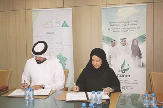Officials of Nama Centre and Injaz Qatar signing the MoU.