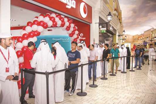 Customers queue at Vodafone Qataru2019s store at Villaggio Mall for the launch of the iPhone X.