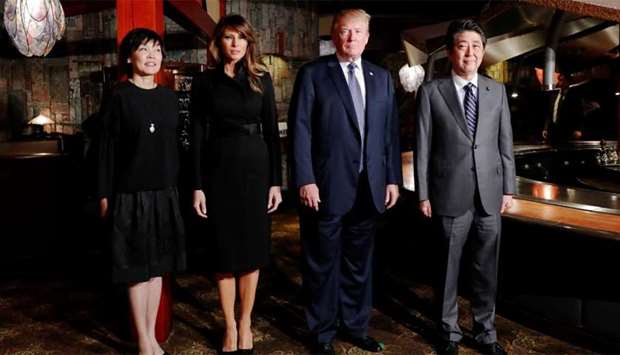 US President Donald Trump and his wife Melania Trump are welcomed by Japan's Prime Minister Shinzo Abe and his wife Akie Abe with a dinner at Ginza Ukai Tei in Tokyo