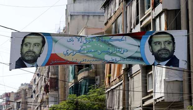 A banner bearing a portrait of Lebanese Prime Minister Saad Hariri in the capital Beirut a day following the announcement of his resignation