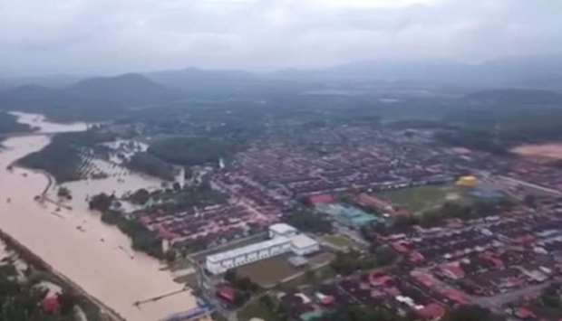 An aerial view shows the banks of a river overflowed after floodwater rose for more than 24 hours of incessant rain, in Kubang Semang, Bukit Mertajam, Penang, Malaysia, in this still image from a video obtained from social media.