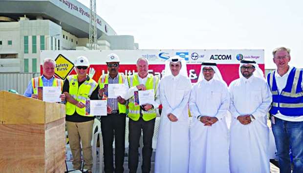 Officials at the celebration to mark Al Rayyan Stadium's construction safety milestone