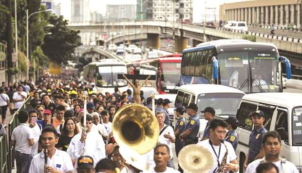 Thousands of people participate in a healing protest in Manila yesterday.