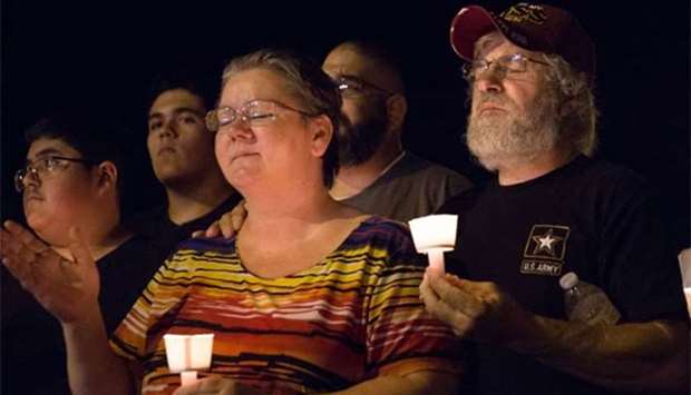 A candlelight vigil is observed on Sunday following the mass shooting at the First Baptist Church in Sutherland Springs, Texas.