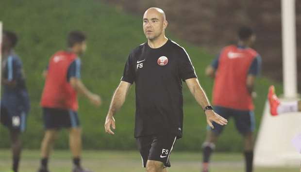 Qatar coach Felix Sanchez conducts a training session yesterday.