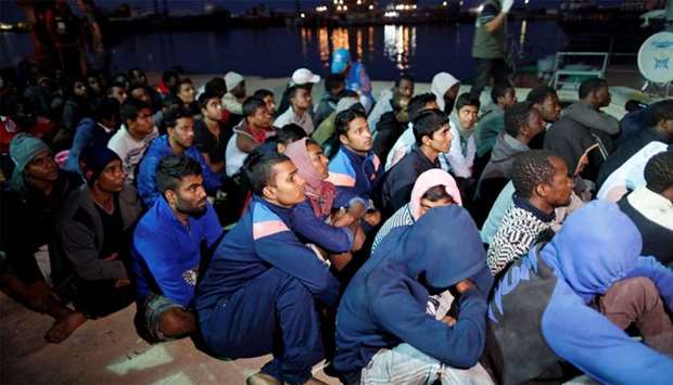 Migrants arrive at a naval base after they were rescued by Libyan Navy, in Tripoli