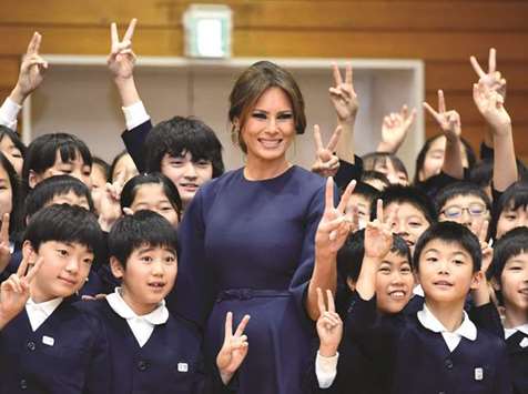 US First Lady Melania Trump poses with 4th graders at the Kyobashi Tsukiji elementary school in Tokyo.