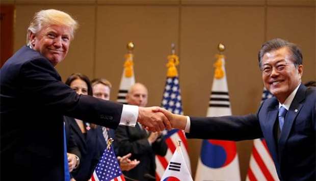 President Donald Trump and South Koreau2019s President Moon Jae-in shake hands during a meeting at Blue House in Seoul on Tuesday.