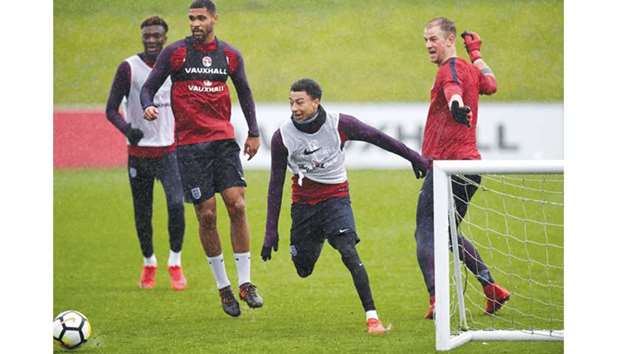 Englandu2019s (from left) Tammy Abraham, Ruben Loftus-Cheek, Jesse Lingard and Joe Hart attend a training session at St Georgeu2019s Park in Burton-on-Trent yesterday,  ahead of their friendly matches against Germany on November 10 and Brazil on November 14. (AFP)