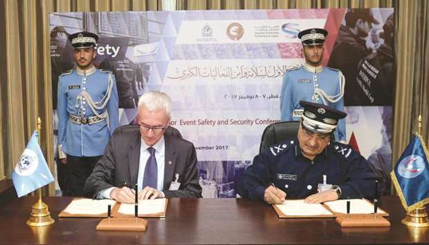 Major General Dr Abdullah Yousuf al-Mal and Interpol Secretary General Jurgen Stok signing the MoU.