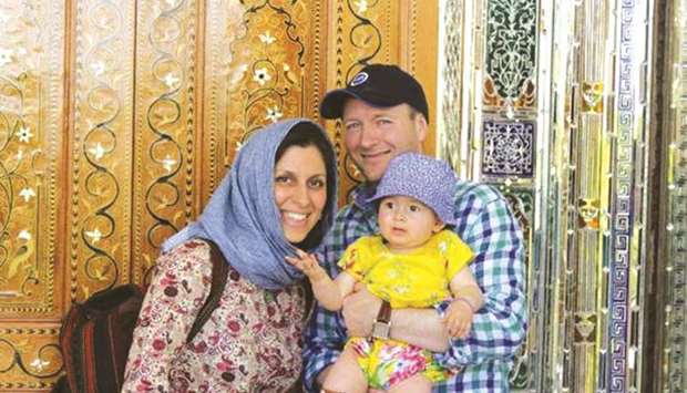 Iranian-British aid worker Nazanin Zaghari-Ratcliffe is seen with her husband Richard Ratcliffe and her daughter Gabriella in an undated photograph handed out by her family.