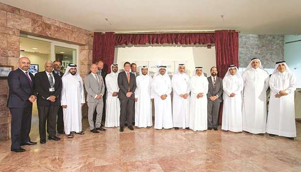 HE the Minister of Energy and Industry Dr Mohamed bin Saleh al-Sada is seen with officials of the companies which were honoured and Texas A&M University at Qatar.