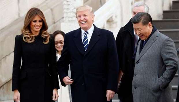 US President Donald Trump and First Lady Melania Trump visit the Forbidden City with China's President Xi Jinping in Beijing on Wednesday.