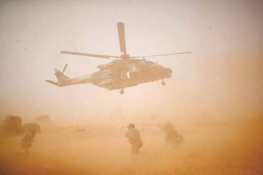 An NH 90 Caiman military helicopter takes-off during the regional anti-insurgent Operation Barkhane in Inaloglog, Mali.