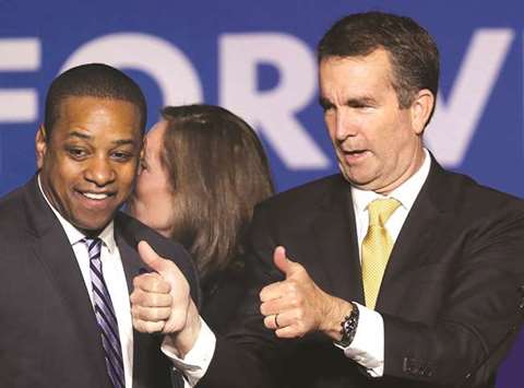 Governor elect Ralph Northam (R) and Lt. Gov.-elect Justin Fairfax greet supporters at an election night rally in Fairfax, Virginia.