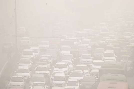 Vehicles drive through heavy smog in Delhi yesterday. The Delhi administration described the city as a u201cgas chamber.u201d