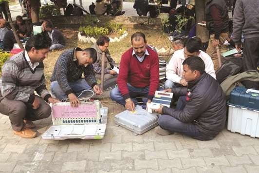 Officials check electronic voting machines ahead of crucial polls, in Dharamsala Himachal Pradesh.