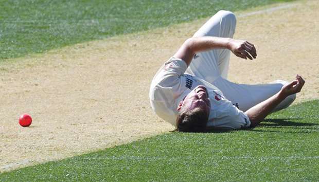 Englandu2019s paceman Jake Ball reacts in pain as he falls on the ground while bowling against Cricket Australia XI in Adelaide yesterday. (AFP)