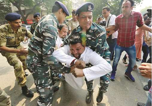 Police detain a supporter of the main opposition Congress Party during a protest to mark two years since demonetisation was implemented by Prime Minister Narendra Modi, outside the Reserve Bank of India building in New Delhi yesterday.