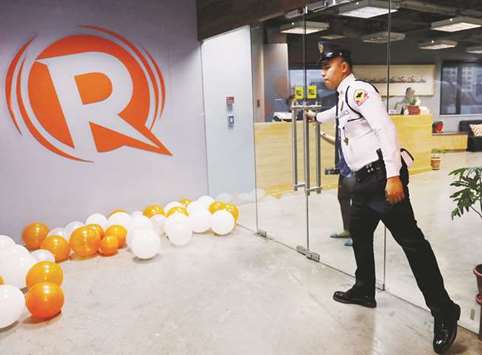 File photo shows a guard at the office of Rappler in Pasig, Metro Manila.