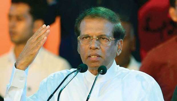 In this file photo, Sri Lankau2019s President Maithripala Sirisena gestures as he addresses supporters at a rally in Colombo.