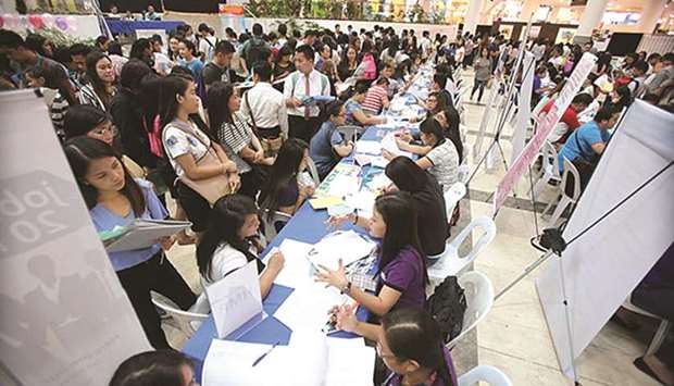 Aspirants are interviewed at a job fair in Glorietta in Makati City.