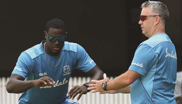 West Indies captain Carlos Brathwaite (left) trains with coach Stuart Law during a practice session ahead of the third T20 international against India in Chennai yesterday. (AFP)