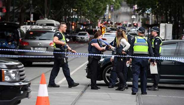 Police work at the crime scene following a stabbing incident in Melbourne