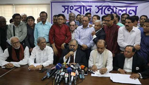 Members of Jatiya Oikyafront, an opposition alliance, hold a news conference at the National Press Club to confirm their participation in the upcoming parliamentary election in Dhaka