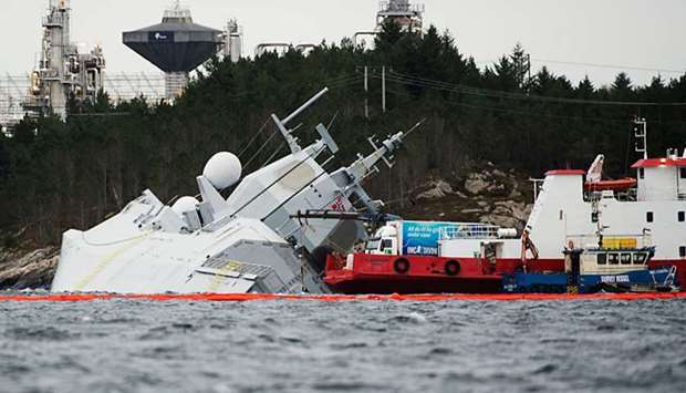 The Norwegian frigate ,KNM Helge Ingstad, takes on water after a collision with the tanker u201cSola TSu201d.