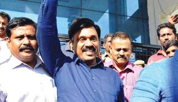 Karnatakau2019s former minister Gali Janardhana Reddy gestures as he is taken by police to a jail, in Bengaluru yesterday.