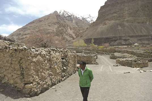 In this picture taken on May 5, Fazal Ali, who has climbed K2 mountain three times, walks near his house in Shimshal village of Hunza valley in northern Pakistan. He is the only man ever to have scaled K2 three times, but Aliu2019s achievements have gone largely unrecognised.