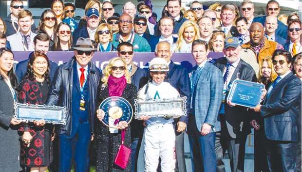 Khater Mohamed Khater al-Khater, First Secretary at the Embassy of the State of Qatar in Washington, DC, with the winners of the 1st edition of the Qatar Cherokee Run Stakes at Breeders Cup World Championships after Audible, ridden by Javier Castellano, won the seven furlong race at Churchill Downs in Louisville, Kentucky, last week. (EclipseSportswire)