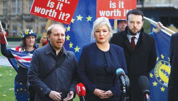 Anti-brexit protesters stand behind as Green Party of Northern Ireland leader Steven Agnew (left), Sinn Fein vice-president Michelle Ou2019Neill (centre), and SDLP leader Colum Eastwood (right), make statements in central London yesterday. The UK is now home to one of the largest grassroots pro-EU movements in Europe.